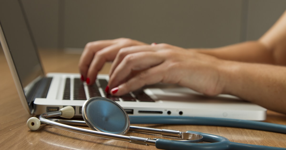 Person comparing pet insurance plans on a laptop — how to choose pet insurance guide